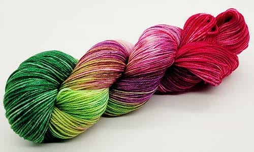 green, pink, and purple yarn