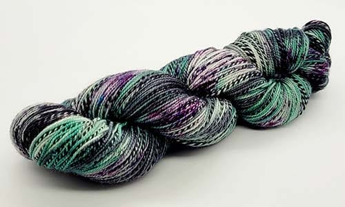 black, purple, and green marled yarn